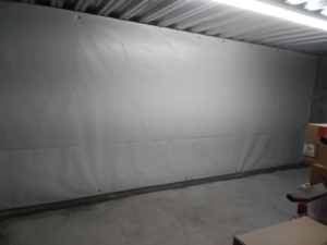 Crawlspace wall encapsulation with a white moisture barrier, installed by Allied Foundation & Crawlspace Solutions to prevent water damage in Decatur, AL.
