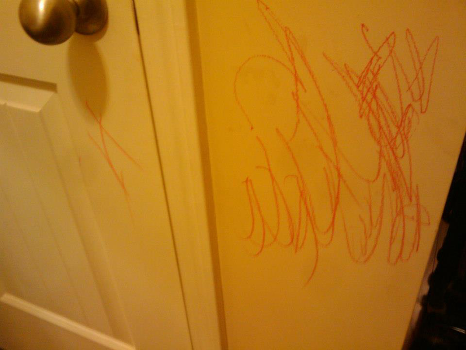 Red crayon marks on a wall, a common cleaning challenge addressed by Karis Klean in Auburn, AL