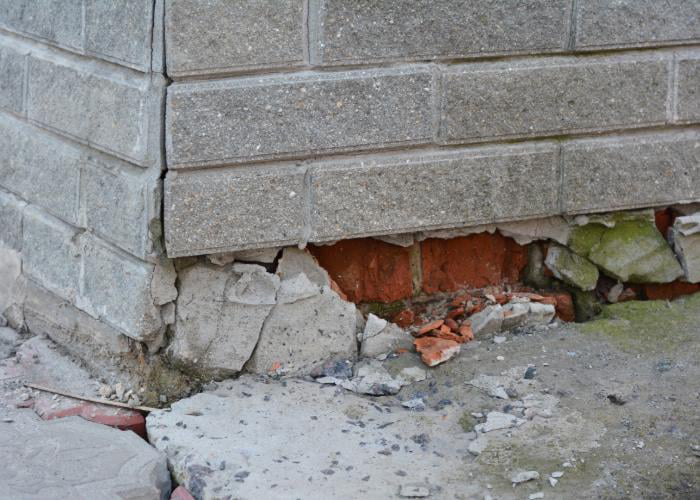 Severely damaged and crumbling foundation corner requiring repair by Fort Wayne Foundation Repair Experts in Fort Wayne, IN.