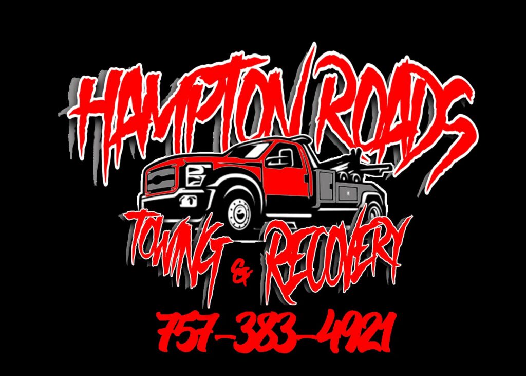 A damaged grey sedan on a flatbed tow truck, towing another dark sedan behind it by Hampton Roads Towing Services in Chesapeake, VA.