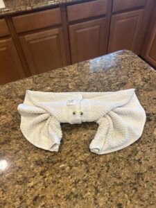 A decorative folded towel with googly eyes on a clean countertop, a special touch from Nichole's Cleaning Service in Fort Wayne, IN