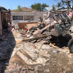 Demolition debris and heavy equipment on a job site handled by DEMO Leaders in Los Angeles, CA