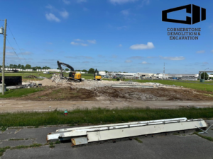 A large demolition site with excavators clearing rubble, performed by Cornerstone Demolition & Excavation in Lexington, KY