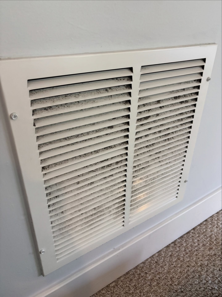 A dirty air vent before professional cleaning by Tidy Townhouses in Manchester, NH.