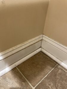 A dirty baseboard in a residential room, indicating a need for detailed cleaning by Deep Cleaning Service in Frederick, MD.