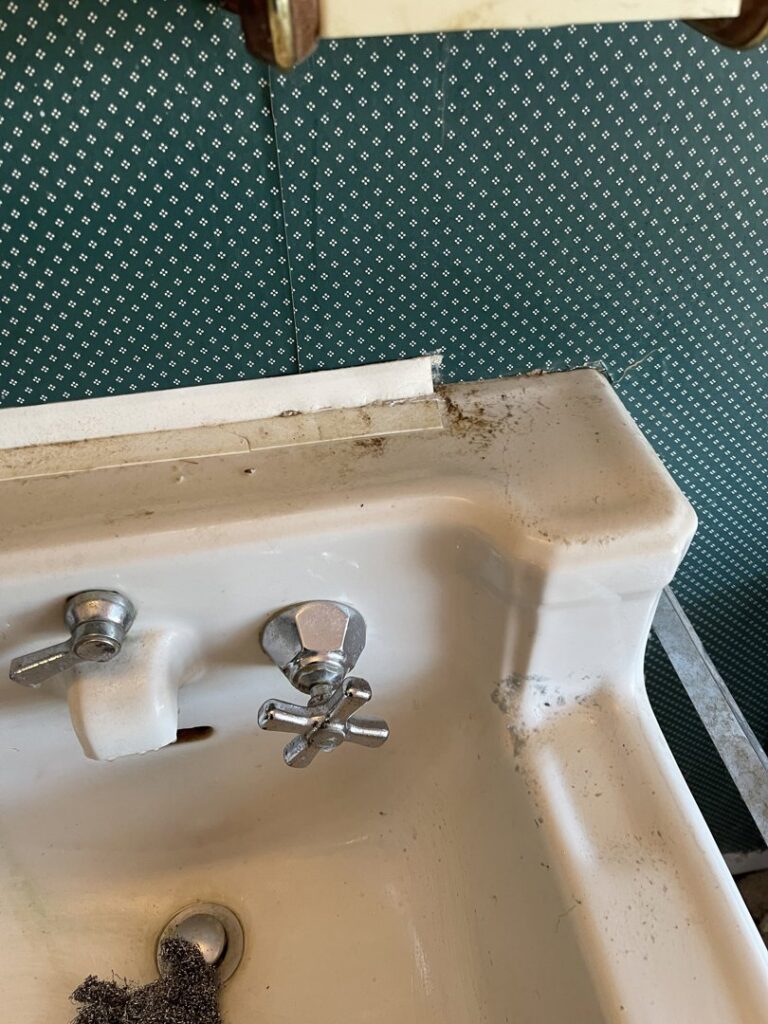 A dirty bathroom sink with grime and soap scum before cleaning by Cinderellas Cleaning in Cerritos, CA