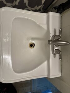 A dirty bathroom sink before professional cleaning by Nikki Sue's Cleaning Services in Gillette, WY.