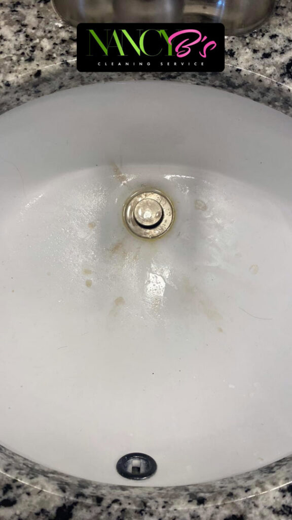 A dirty bathroom sink with visible stains before cleaning by Nancy B's Cleaning Service LLC in Atlanta, GA.