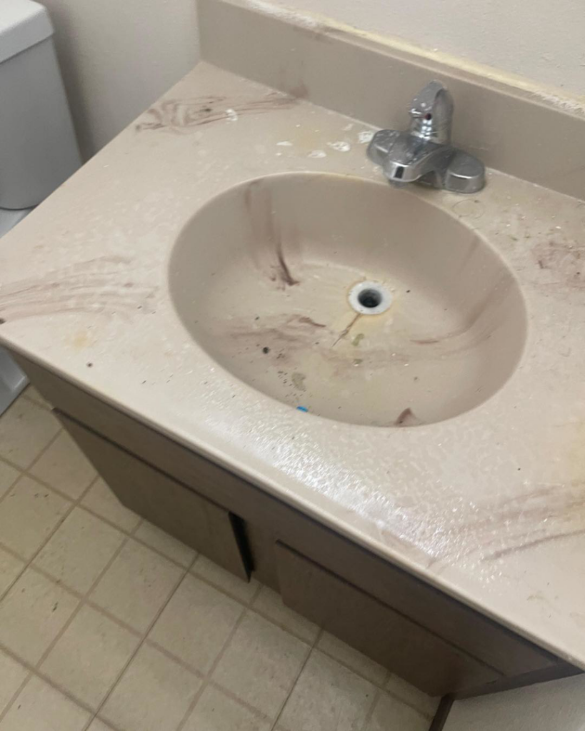 A dirty bathroom sink and vanity, showing an area ready for cleaning by Home Clean Home By Maria LLC in Aberdeen, SD.