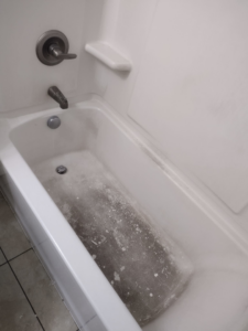 A very dirty bathtub before cleaning, showcasing the need for services from By Grace Cleaning Solutions, LLC in Cincinnati, OH.