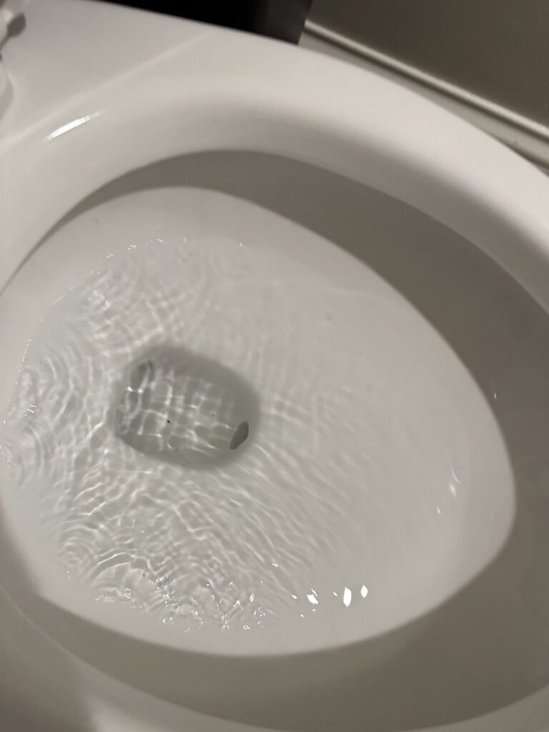 A dirty bathtub with visible grime and hair, ready for a deep clean by J + M Cleaning, LLC in Flint, MI.