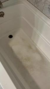 A dirty bathtub showing before cleaning services from Lorena Lyons Cleaning in Concord, NH.