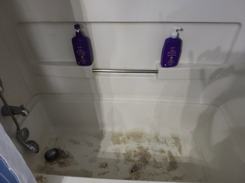 A very dirty bathtub before professional cleaning by No Stress Cleaning Services in Virginia Beach, VA