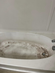 A very dirty bathtub before professional cleaning by Right Now Cleaning Services in Toledo, OH.