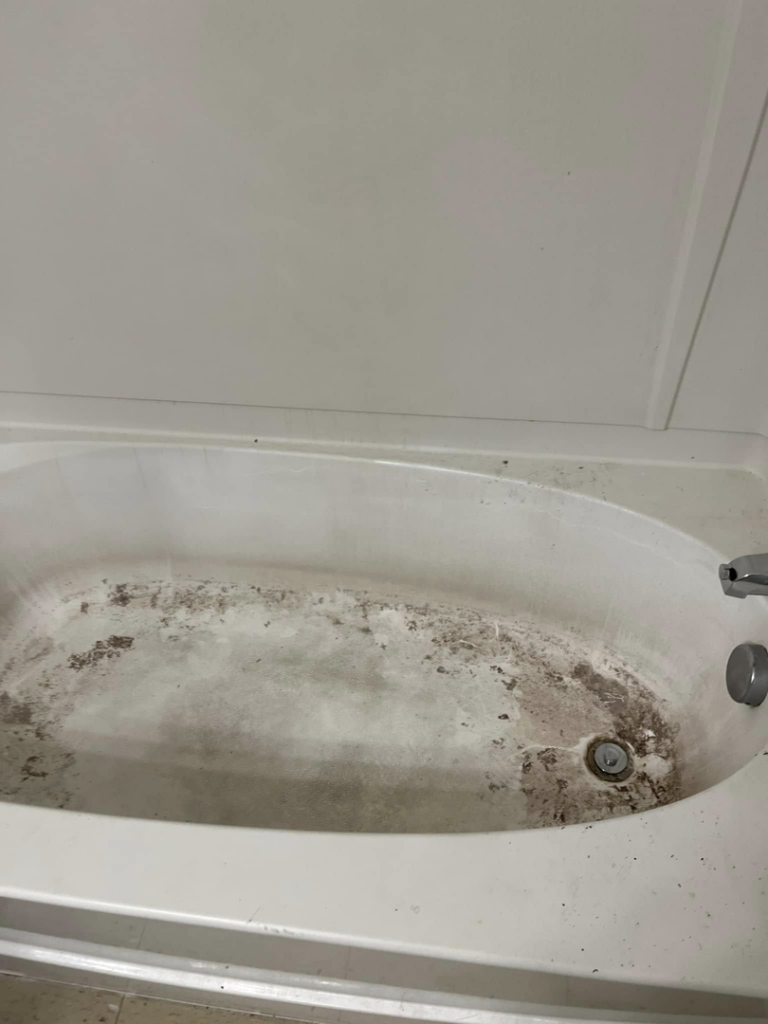 A very dirty bathtub before professional cleaning by Right Now Cleaning Services in Toledo, OH.