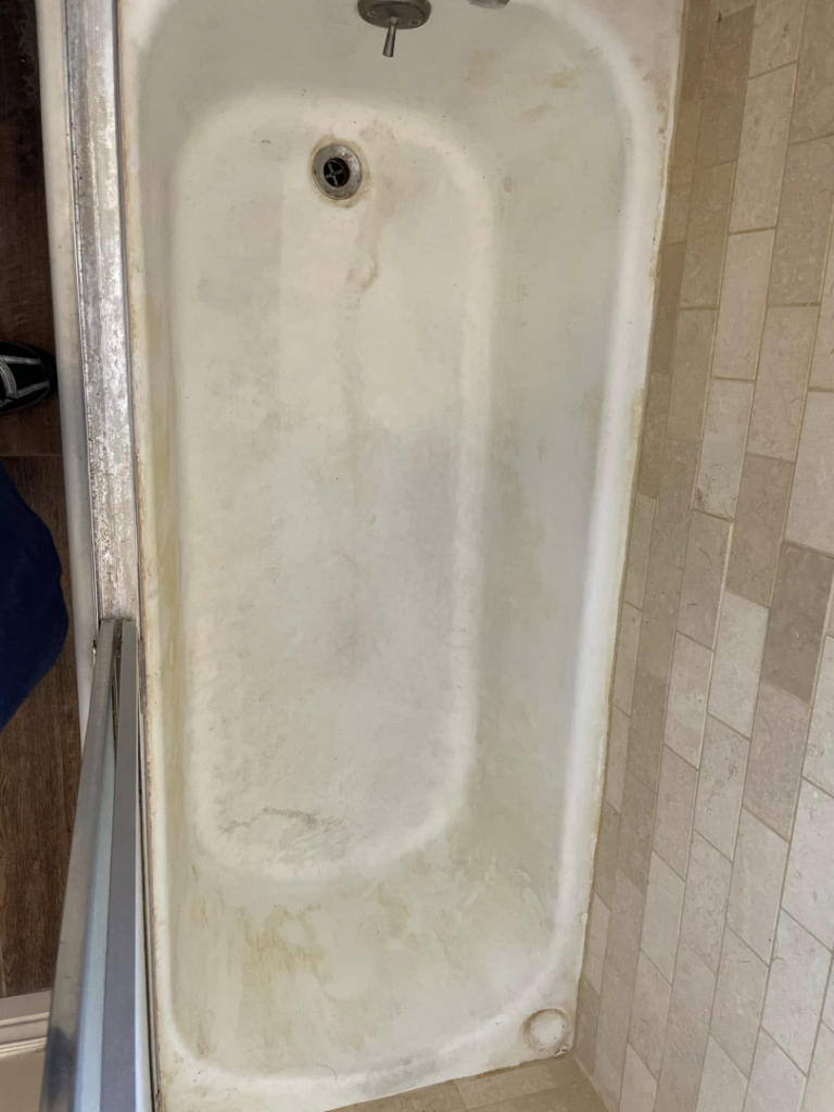 A dirty bathtub with visible grime, awaiting a professional cleaning service from Maid It Dirty Cleaning Company in Phoenix, AZ.