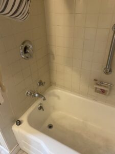 A dirty bathtub with visible grime and stains, highlighting a cleaning challenge for Final Touch & More in Fort Wayne, IN