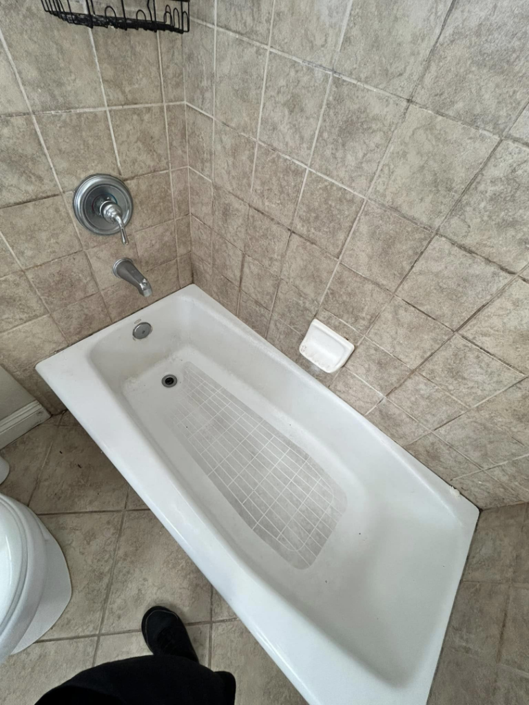 A dirty bathtub with visible residue and grime before professional cleaning by Superior Quality Cleaners in Sacramento, CA