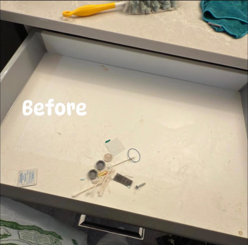 A dirty drawer with miscellaneous items before cleaning by Auro Cleaning Services in Plainfield, IL