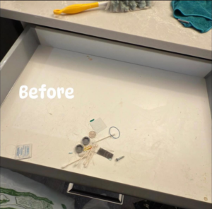 A dirty drawer with miscellaneous items before cleaning by Auro Cleaning Services in Plainfield, IL