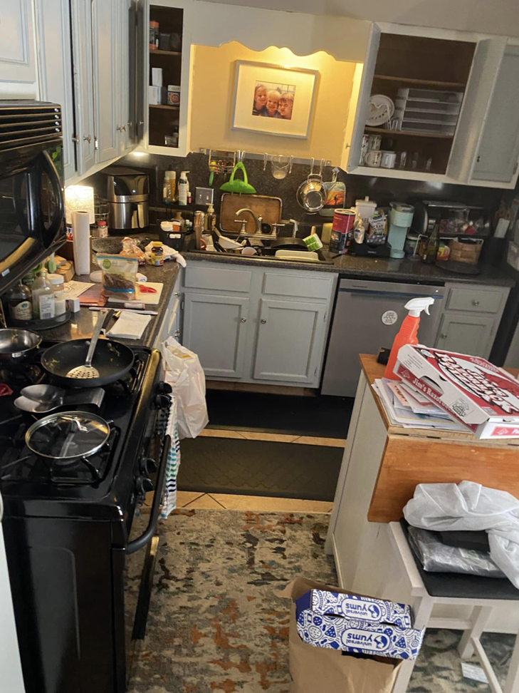 A very dirty kitchen with dishes in the sink and cluttered counters, ready for deep cleaning by EMarie Professional Cleaning Services & More in Little Rock, AR.