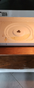 A dirty microwave interior with food splatters before cleaning by Creativity Cleaning LLC in Detroit, MI.