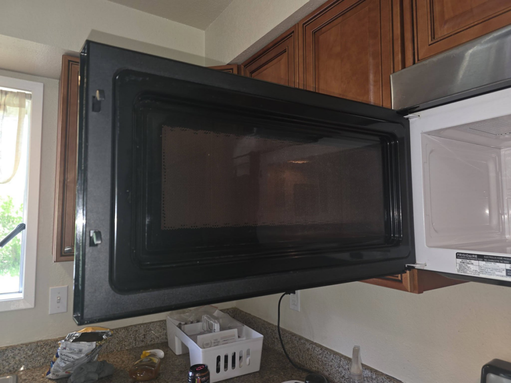 A dirty microwave interior before cleaning by Perfectly Maid in Spokane, WA.