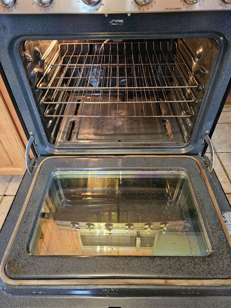 A dirty oven interior before professional cleaning by No Stress Cleaning Services in Virginia Beach, VA