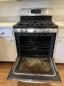 A dirty oven interior before cleaning by V's Residential Cleaning Services in Tacoma, WA.