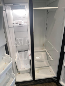 A dirty and empty refrigerator interior before professional cleaning by VM Residential cleaning LLC in Baton Rouge, LA.