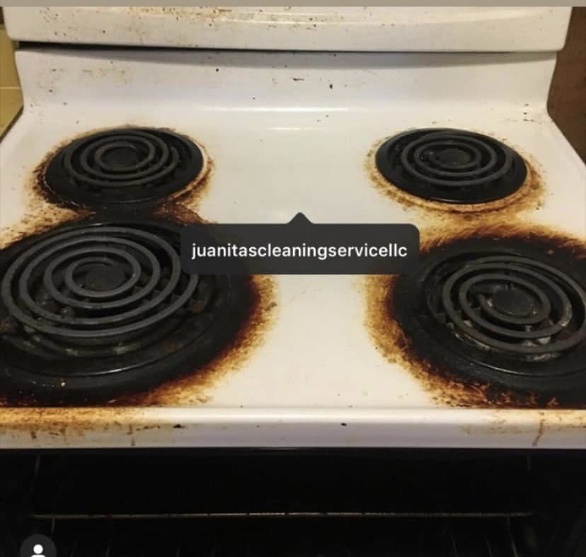 A very dirty stove top with burnt residue before professional cleaning by Juanita's Cleaning Services LLC in Gulfport, MS.