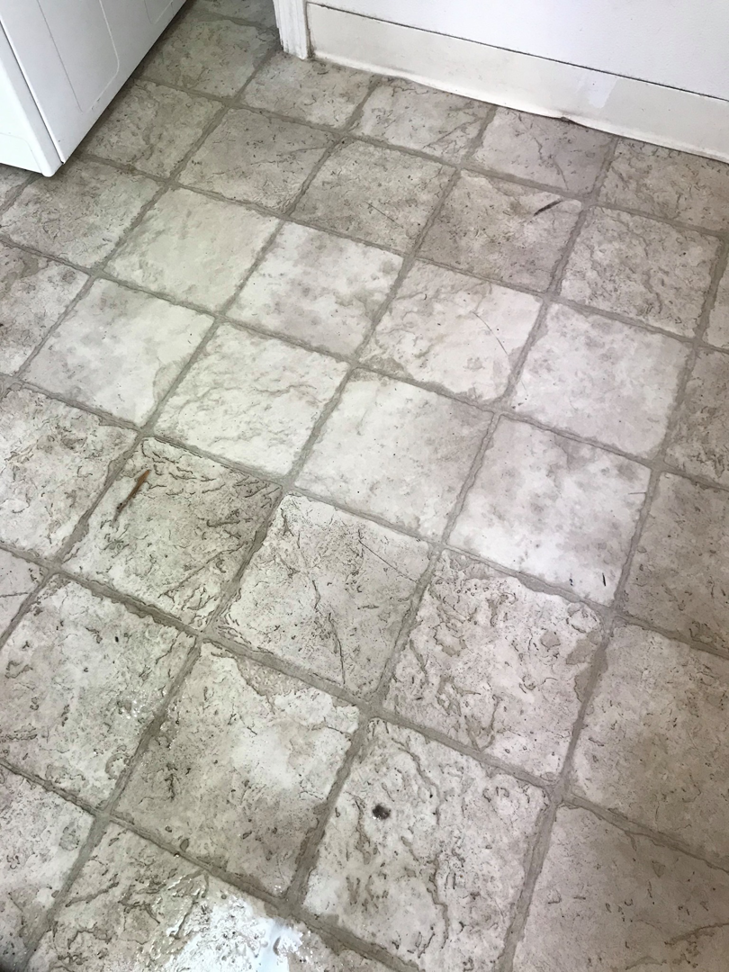 A dirty tiled floor before professional cleaning by Sharp & Clean in Idaho Falls, ID.