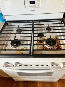 A dirty tiled shower with visible grime and soap scum before cleaning by Sage & Soap Cleaning Co in Kansas City, MO.