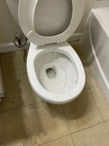 A dirty toilet before professional house cleaning by Right Now Cleaning Services in Toledo, OH.