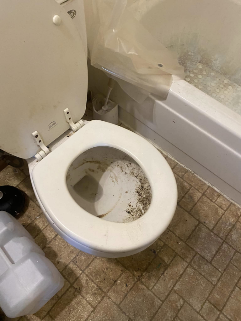 A very dirty toilet before professional cleaning by S&R Services LLC in Anchorage, AK.