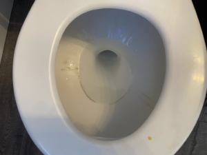 A dirty toilet bowl showing grime and stains before a thorough cleaning by Mireles Cleaning LLC in Caldwell, ID.