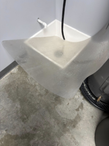 A dirty utility sink area and floor needing cleaning by Danielle's cleaning service in Xenia, OH
