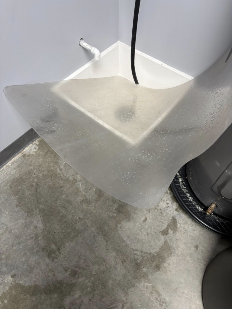 A dirty utility sink area and floor needing cleaning by Danielle's cleaning service in Xenia, OH