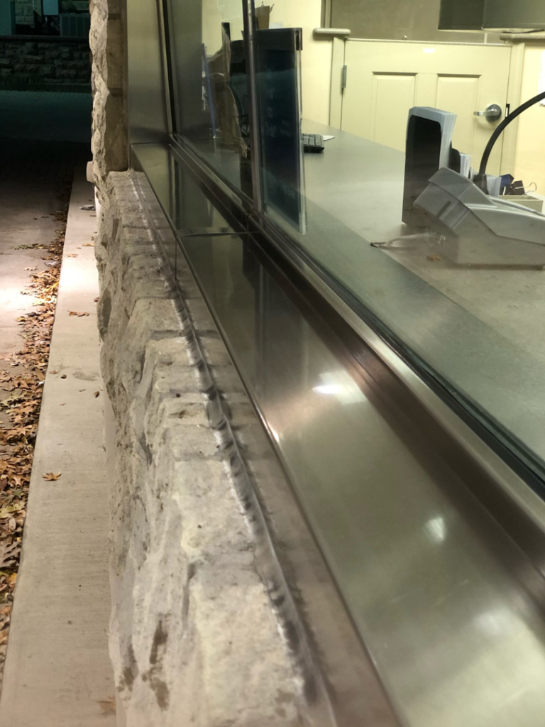 A dirty window sill and counter before professional cleaning by Ascent Cleaning Solutions, LLC in Nashville, TN
