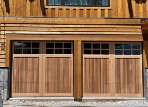 Two custom wooden garage doors with windows installed by Overhead Door of Sierra Nevada in Reno, NV.