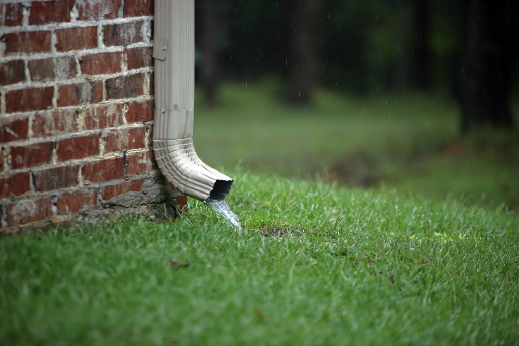 A downspout effectively draining rainwater away from a home, a service provided by Papillion Windows & Siding - NE in Papillion, NE.