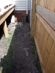 A downspout extension directing water away from a home's foundation by Tidewater Home Improvement LLC in Hampton, VA.