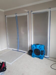 Drying equipment and plastic containment barriers set up for water damage restoration by Bordi Restoration in San Leandro, CA