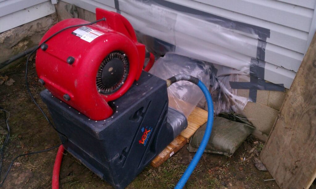 Drying equipment, including an air mover and dehumidifier, used for water damage restoration by Directed Heat Restoration, Livonia, MI.