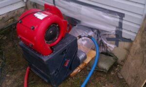 Drying equipment, including an air mover and dehumidifier, used for water damage restoration by Directed Heat Restoration, Livonia, MI.