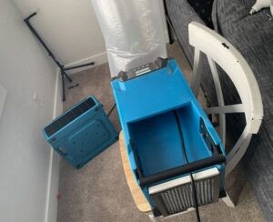Blue drying equipment used for water damage restoration in a home by RestoPros of Salt Lake City, UT