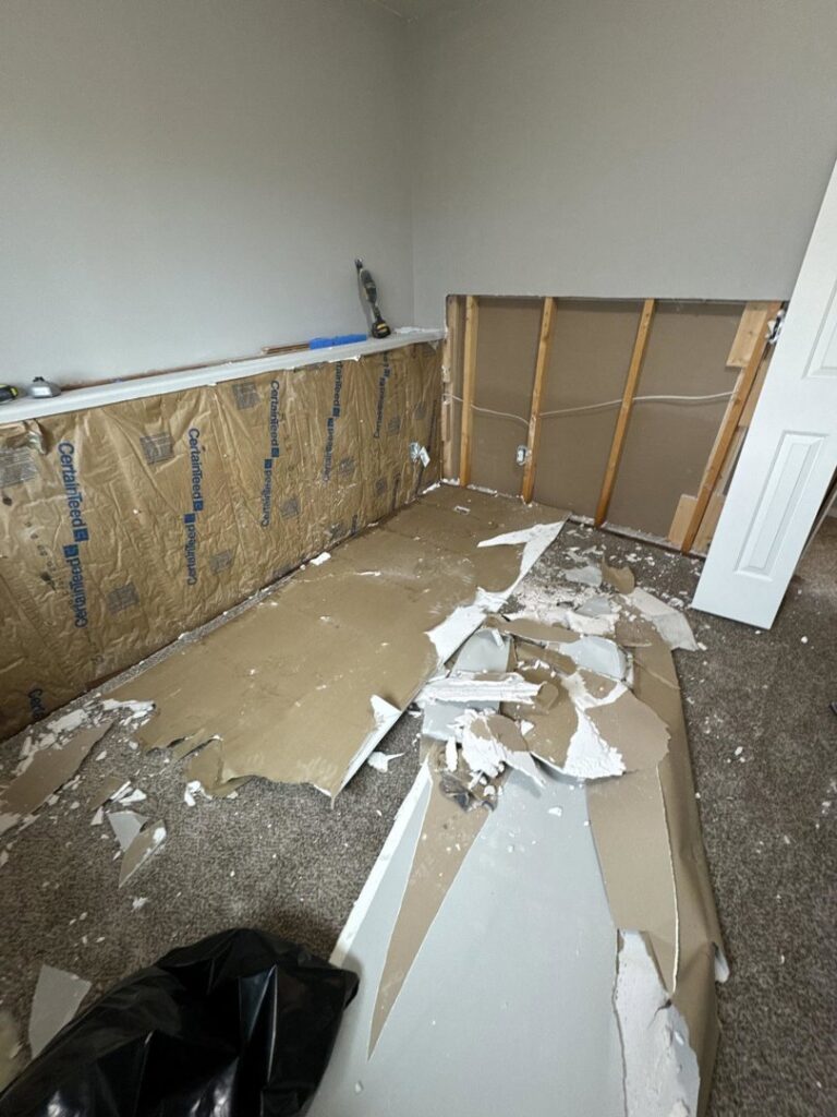 Drywall removed from lower walls for water damage remediation by 406 Disaster Response in Billings, MT.