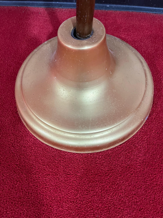 A dusty brass lamp base before professional cleaning by Ascent Cleaning Solutions, LLC in Nashville, TN