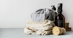 Eco-friendly cleaning supplies including an all-purpose cleaner and scrub brush, used by Breit Home Services in Appleton, WI.
