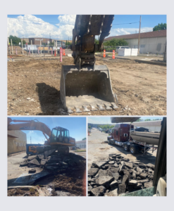 An excavator from Independent Concrete Cutter Corp. breaking up pavement and loading debris at a demolition site in Denver, CO.